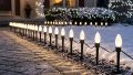 Light Speed Stakes lining a walkway using C7 LED white bulbs.